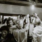 Bride and groom drinking shots