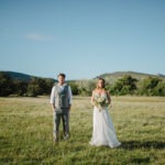 Bride and groom in paddock