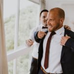 Groom getting dressed