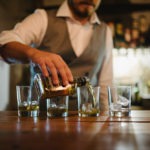 Groom pouring drinks
