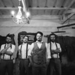 Groomsmen in cigar lounge