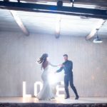 Bride and groom dance on stage
