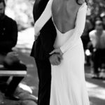 Bride and groom holding hands in ceremony