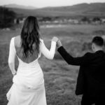 Bride and groom walking hand in hand