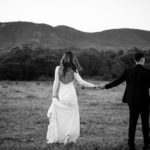 Bride and groom with hills in the background